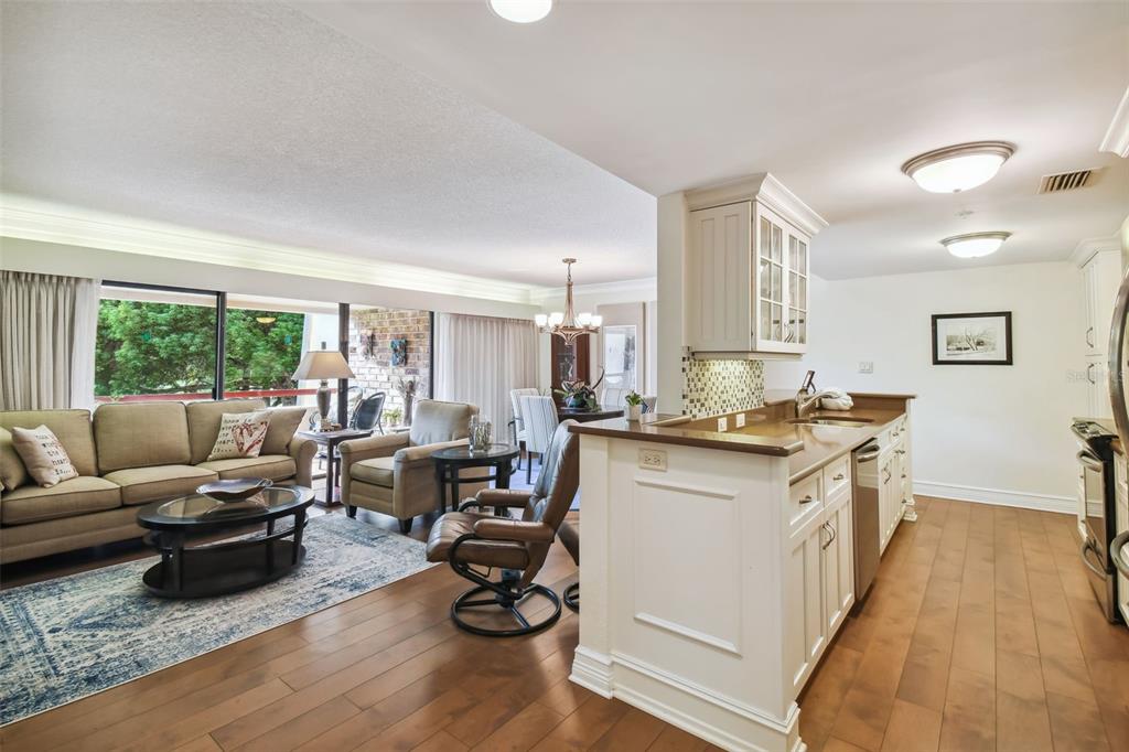 36750 Highway 19, Unit 23213 Palm Harbor, FL 34684 - Photo 3 of 73 a living room with furniture and a large window