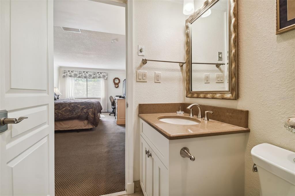 36750 Highway 19, Unit 23213 Palm Harbor, FL 34684 - Photo 44 of 73 a en suite bathroom with a sink and a mirror