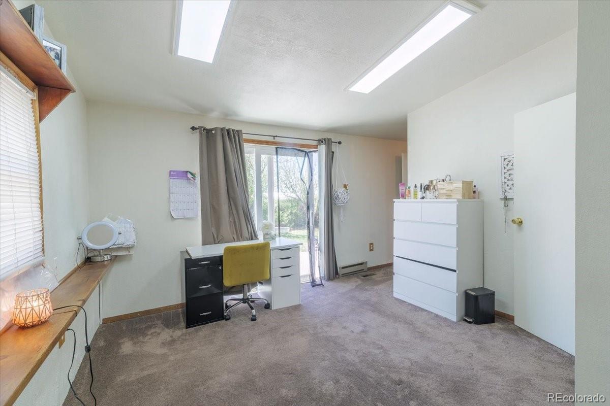 2283 Haskell Way Watkins, CO 80137 - Photo 15 of 36 a room with furniture and a window