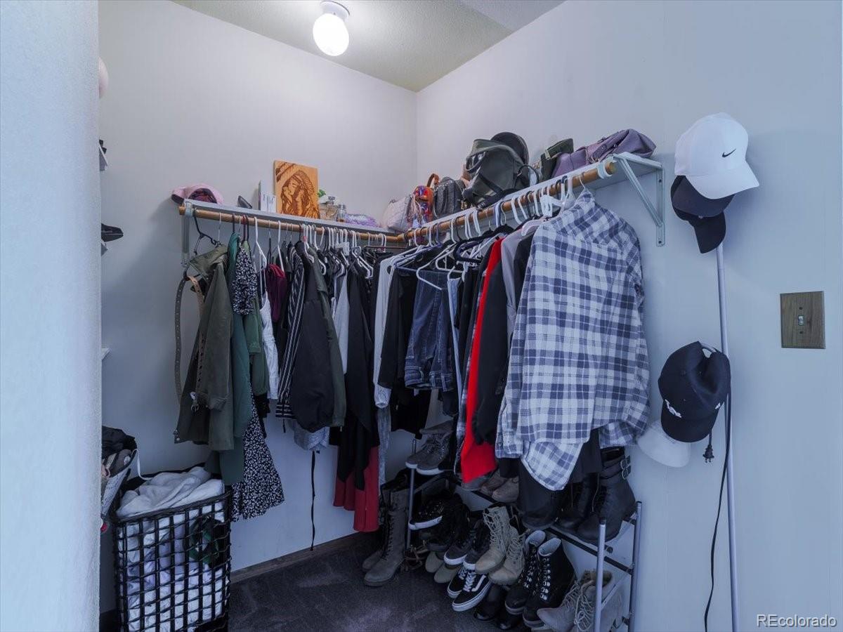 2283 Haskell Way Watkins, CO 80137 - Photo 16 of 36 a view of a closet with storage