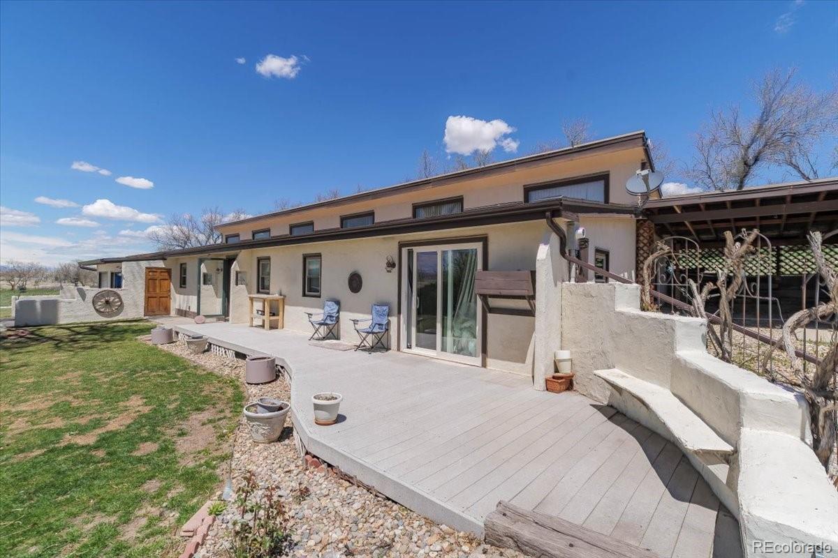 2283 Haskell Way Watkins, CO 80137 - Photo 2 of 36 front view of a house with a patio