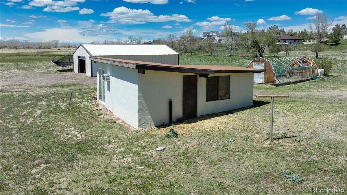 2283 Haskell Way Watkins, CO 80137 - Photo 22 of 36 a view of a big yard with potted plants