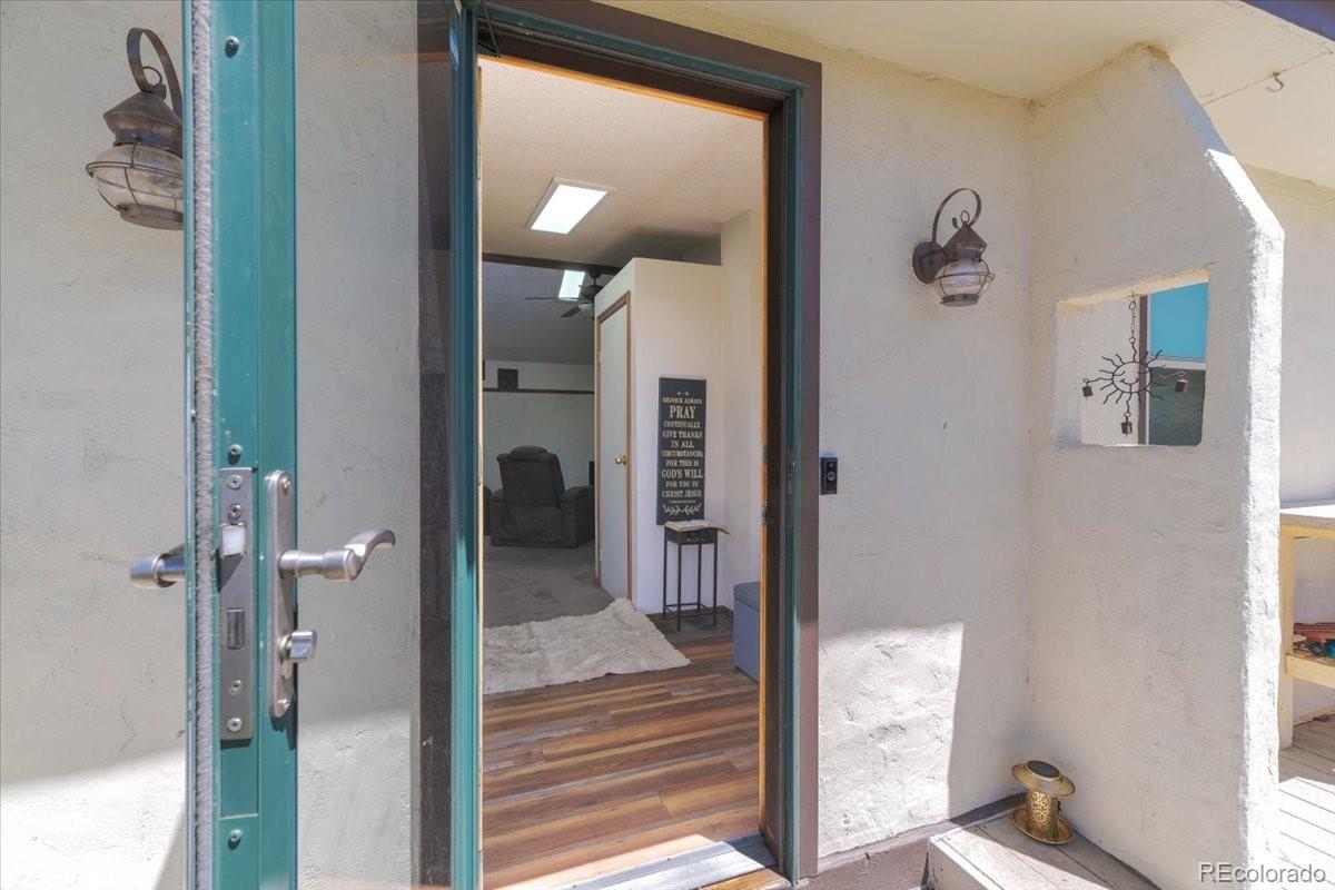 2283 Haskell Way Watkins, CO 80137 - Photo 5 of 36 a view of a hallway with wooden floor and entryway