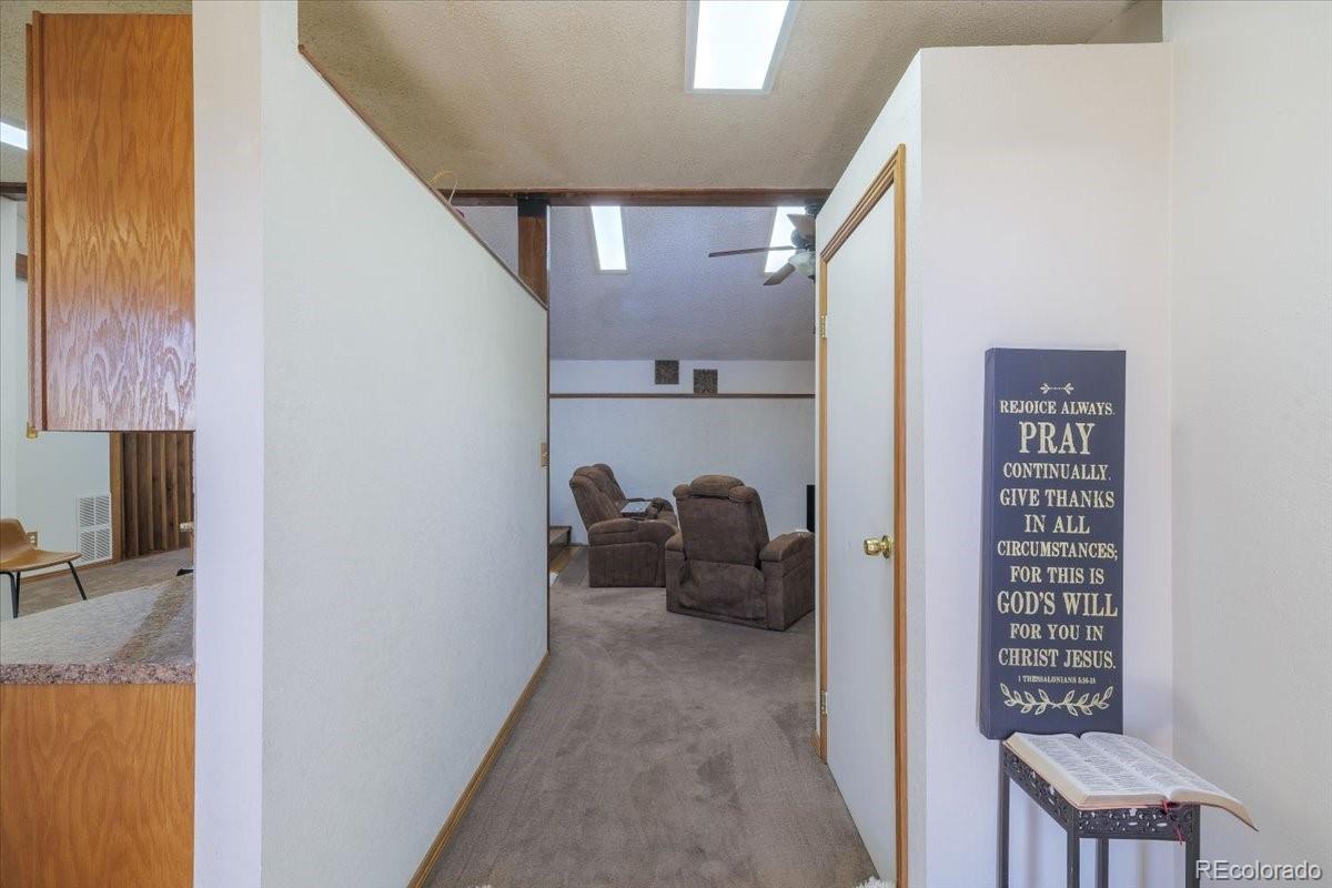 2283 Haskell Way Watkins, CO 80137 - Photo 6 of 36 a view of hallway with livingroom and furniture