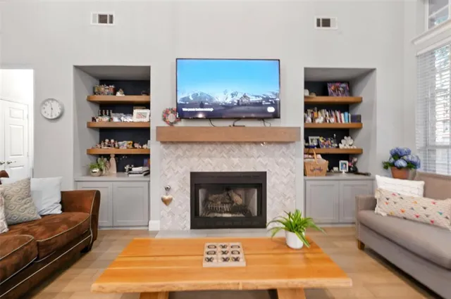a living room with furniture and a fireplace