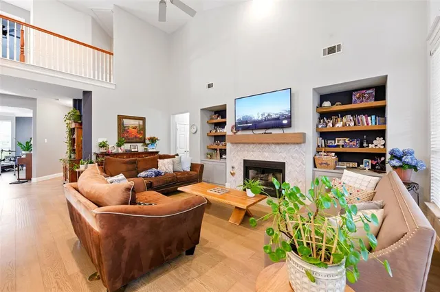 a living room with furniture and a fireplace