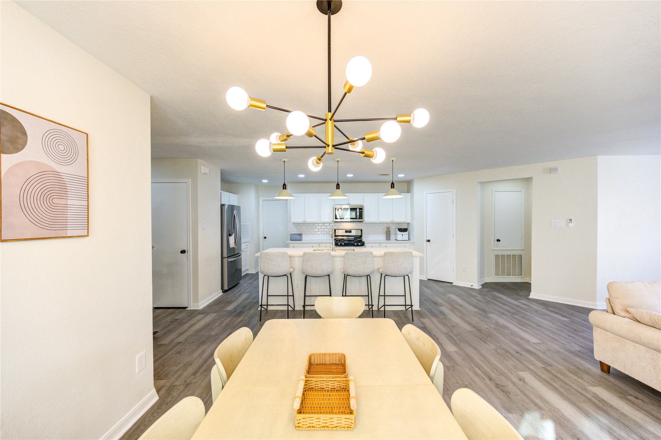 1010 Hummingbird Point Lane Houston, TX 77090 - Photo 14 of 50 a living room with a couch and chandelier