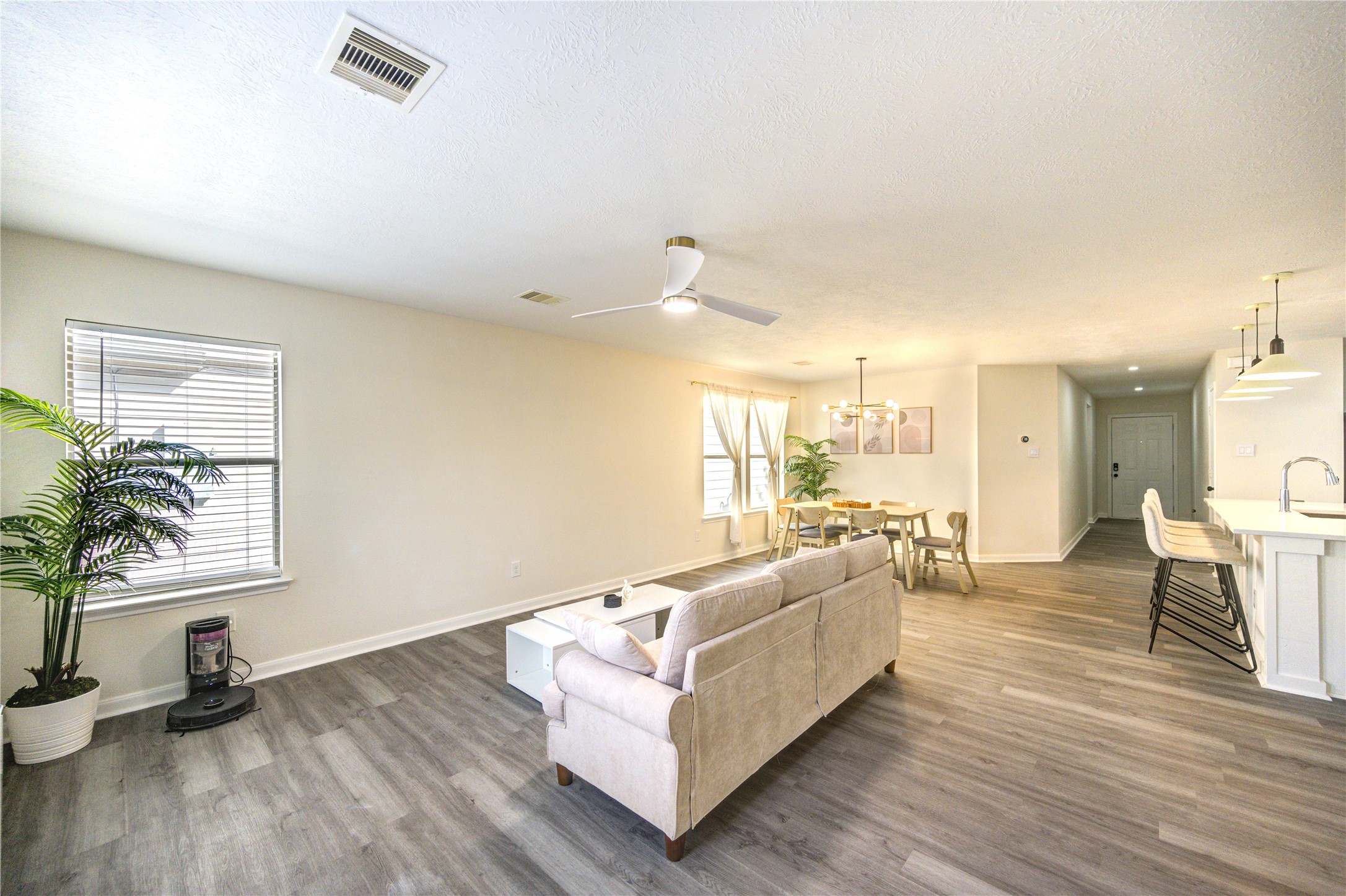 1010 Hummingbird Point Lane Houston, TX 77090 - Photo 19 of 50 a living room with furniture and a large window