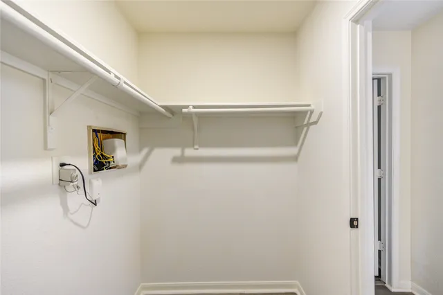 a bathroom with a shower and a glass door