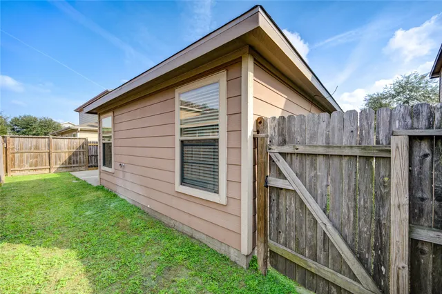 a view of a back yard of the house