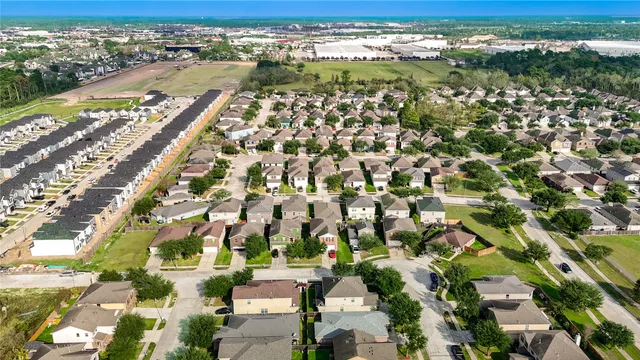 an aerial view of residential houses with outdoor space