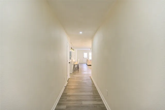 a view of a hallway with a white walls