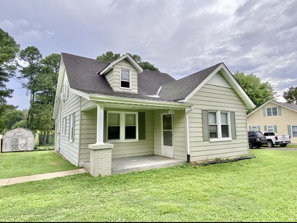 110 East Main Street Loretto, TN 38469 - Photo 1 of 10 a front view of a house with a yard