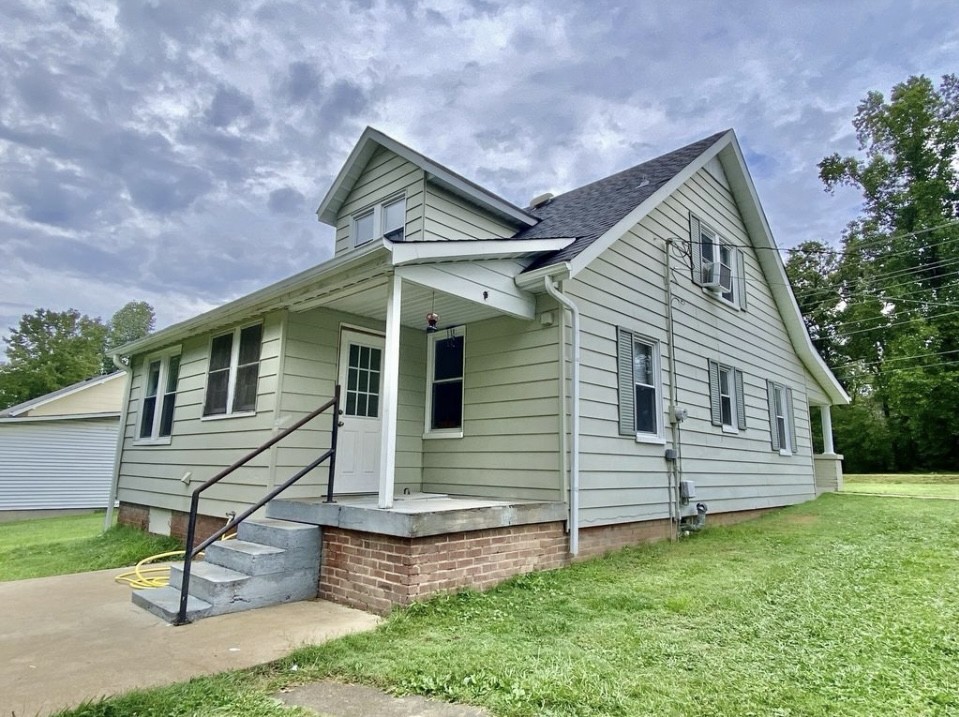 110 East Main Street Loretto, TN 38469 - Photo 2 of 10 a front view of a house with a yard