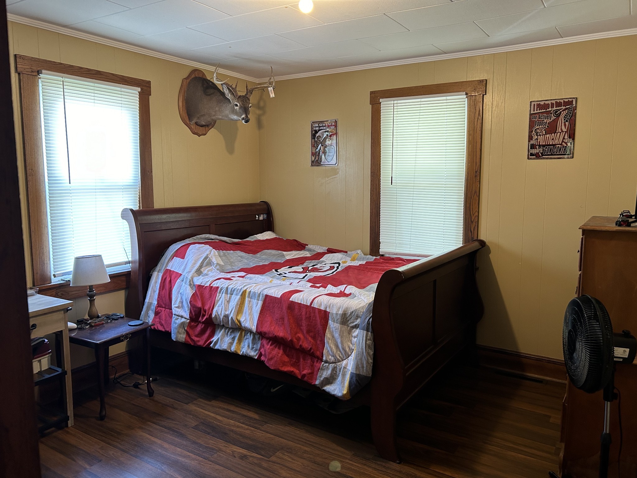 110 East Main Street Loretto, TN 38469 - Photo 7 of 10 a bedroom with a bed a dresser and wooden floor