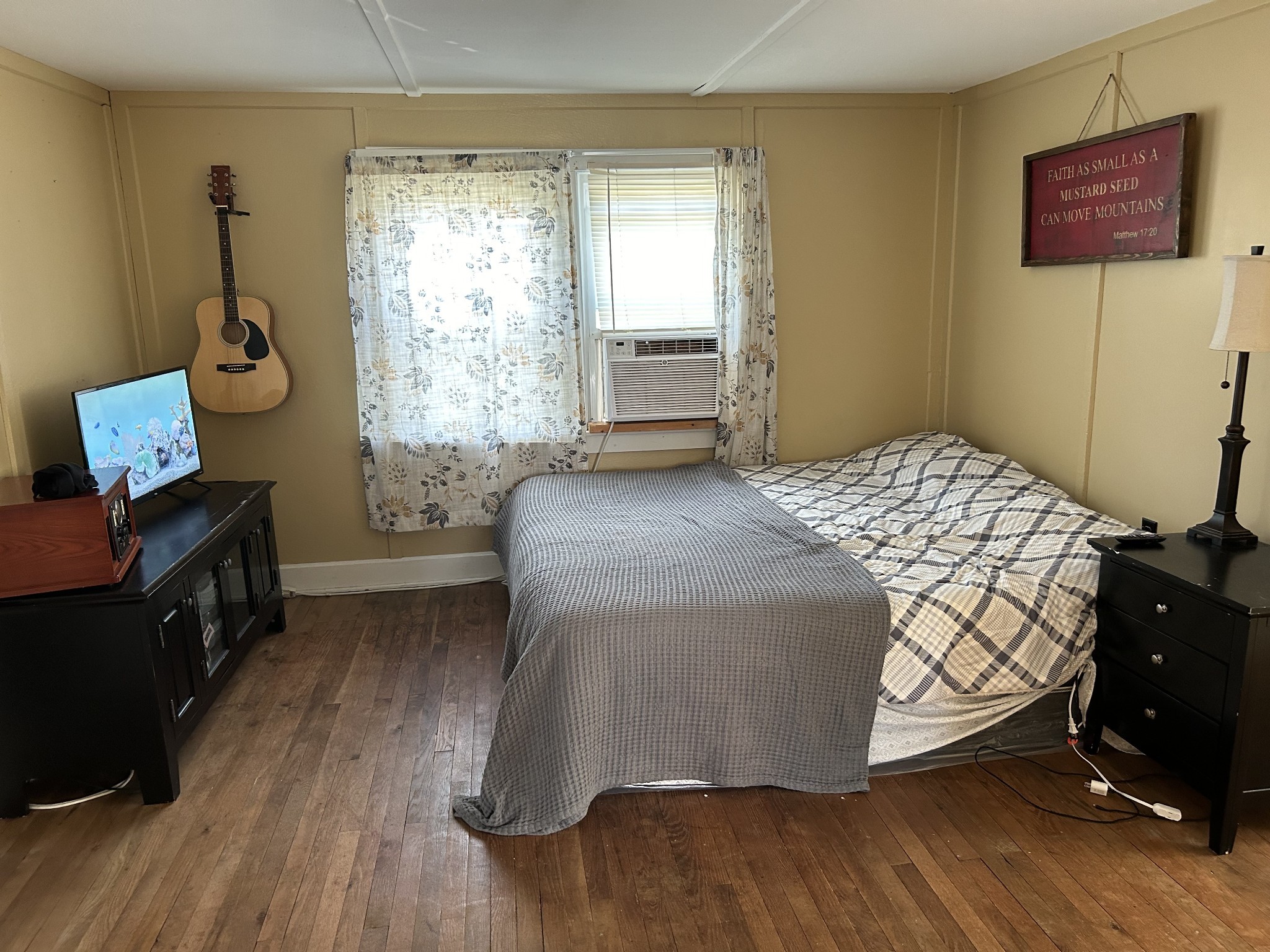 110 East Main Street Loretto, TN 38469 - Photo 9 of 10 a bedroom with a bed and wooden floor