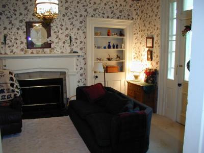 Living room has a fireplace, built-in bo