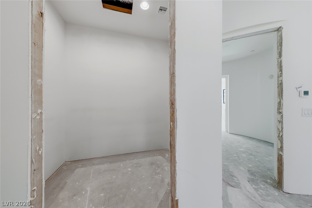 1140 Julie Road Henderson, NV 89002 - Photo 58 of 71 A versatile space awaiting custom finishes, featuring a ceiling-mounted light fixture.