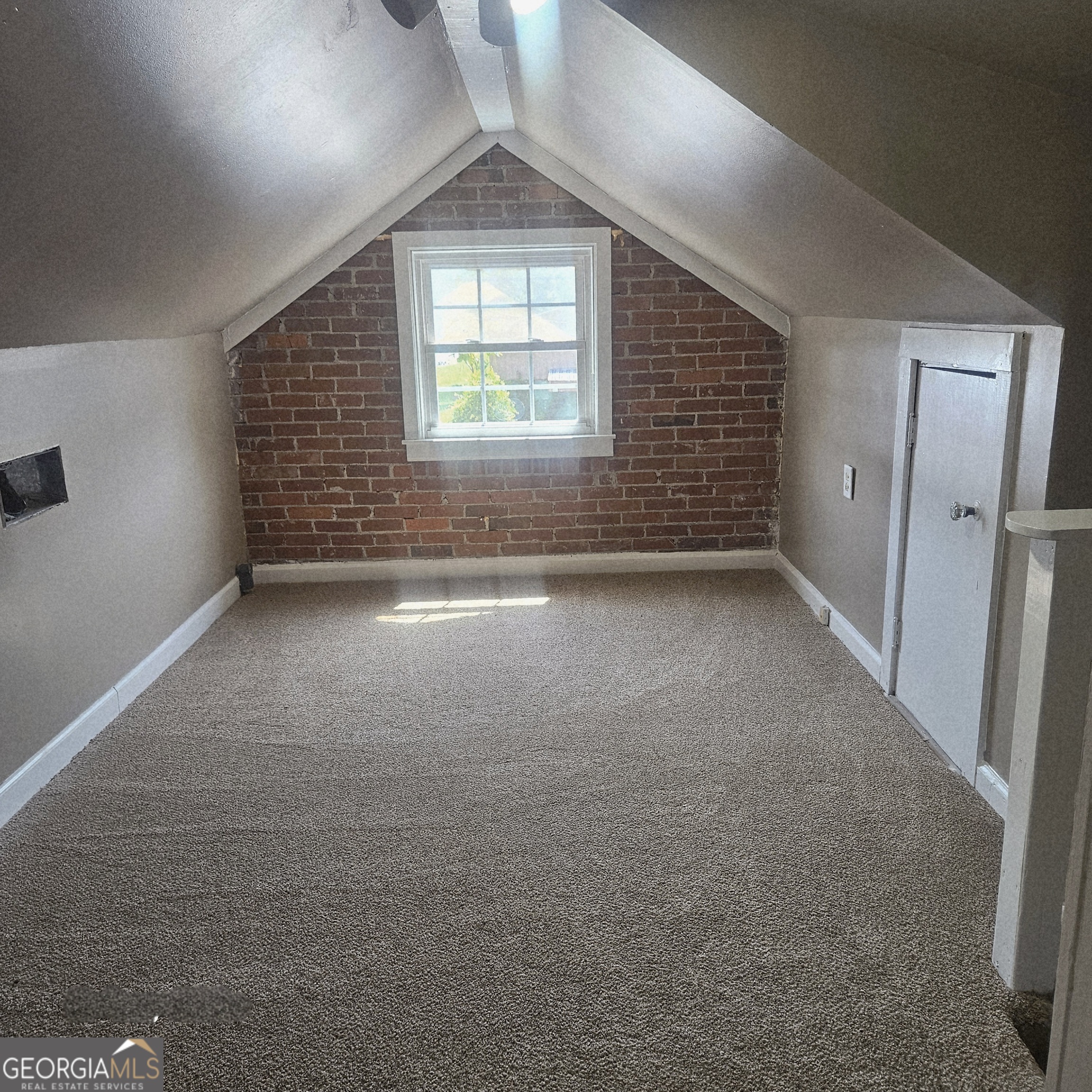 107 East Liberty Street Claxton, GA 30417 - Photo 14 of 29 an empty room with windows