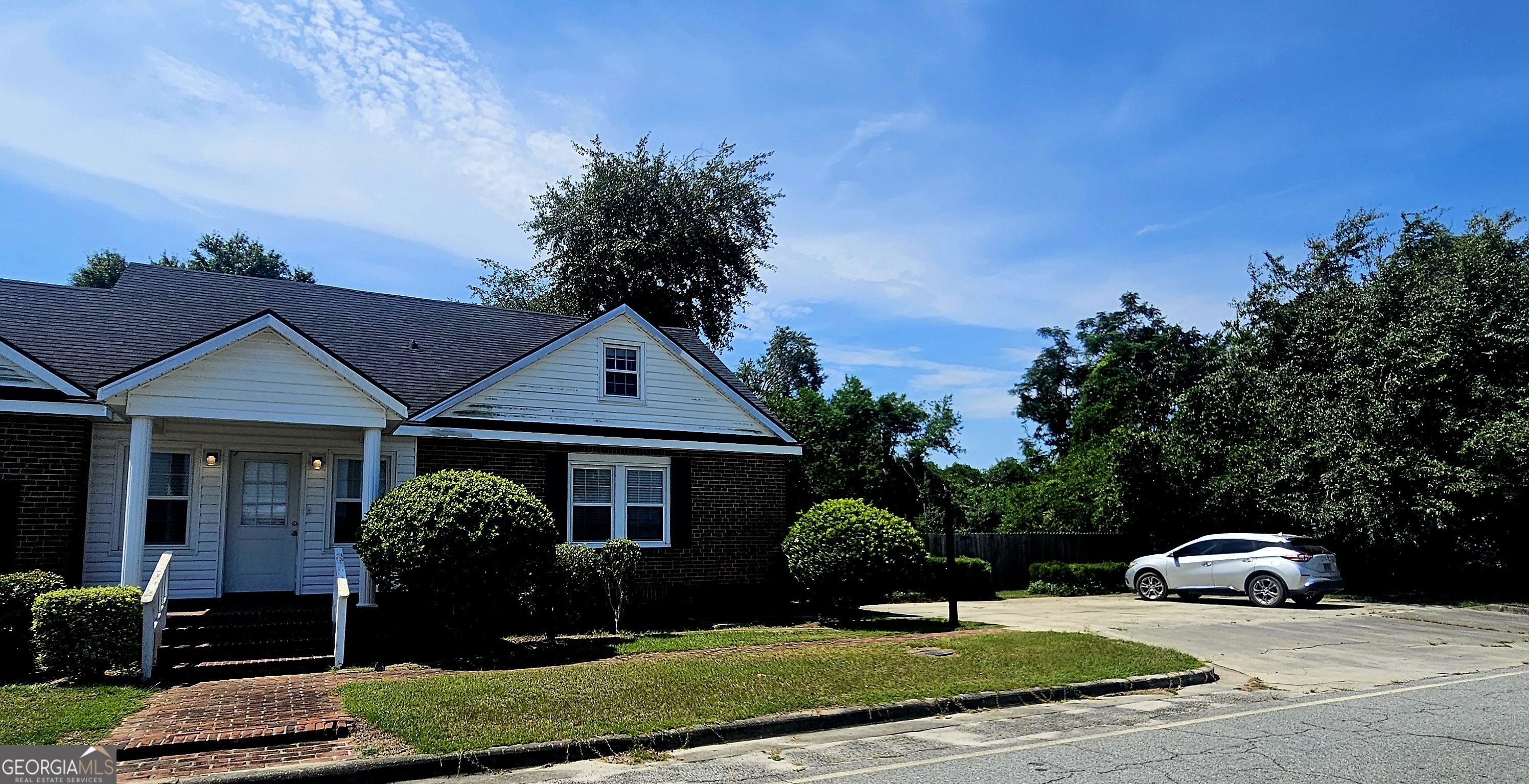 107 East Liberty Street Claxton, GA 30417 - Photo 2 of 29 a front view of a house with a yard