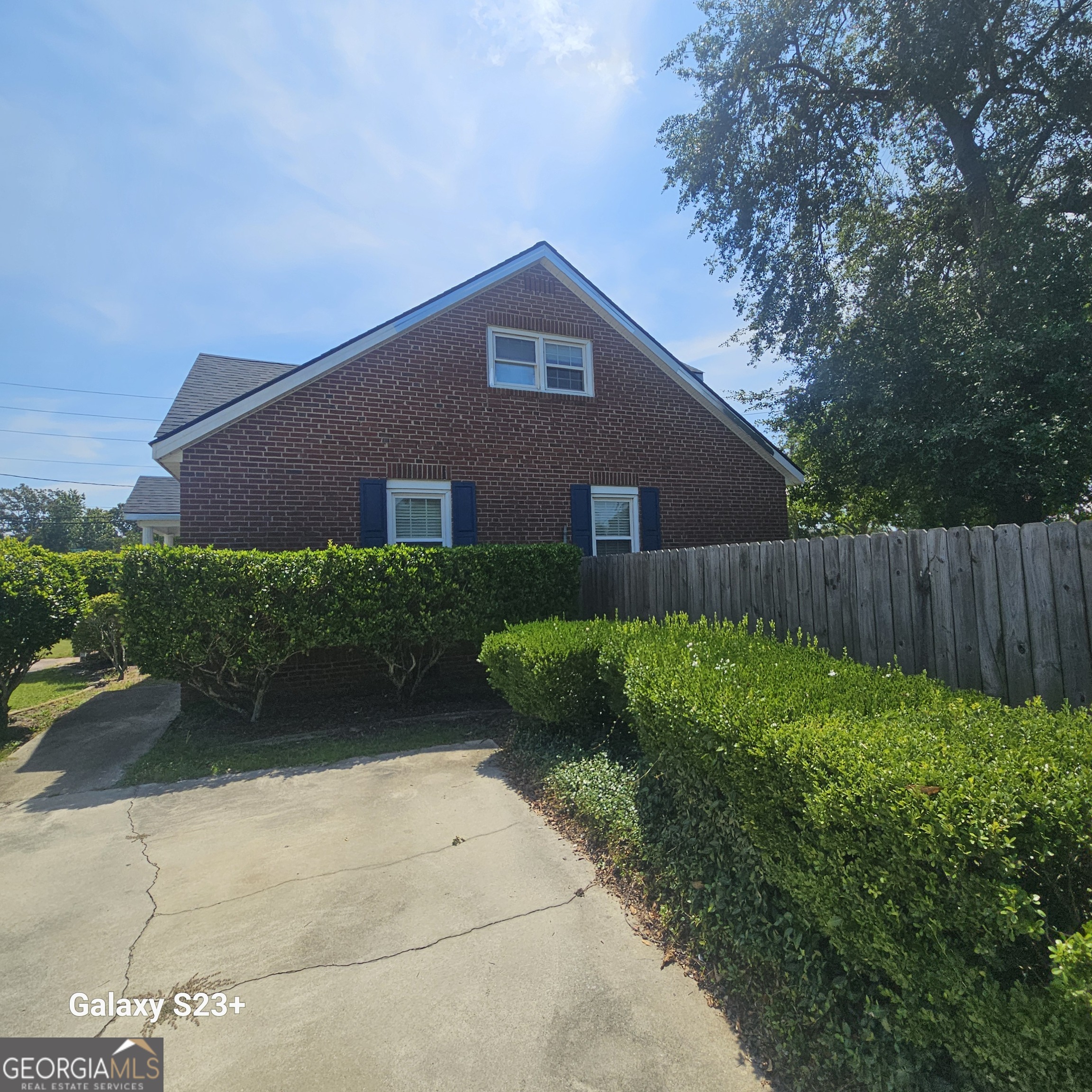 107 East Liberty Street Claxton, GA 30417 - Photo 23 of 29 a front view of a house with garden