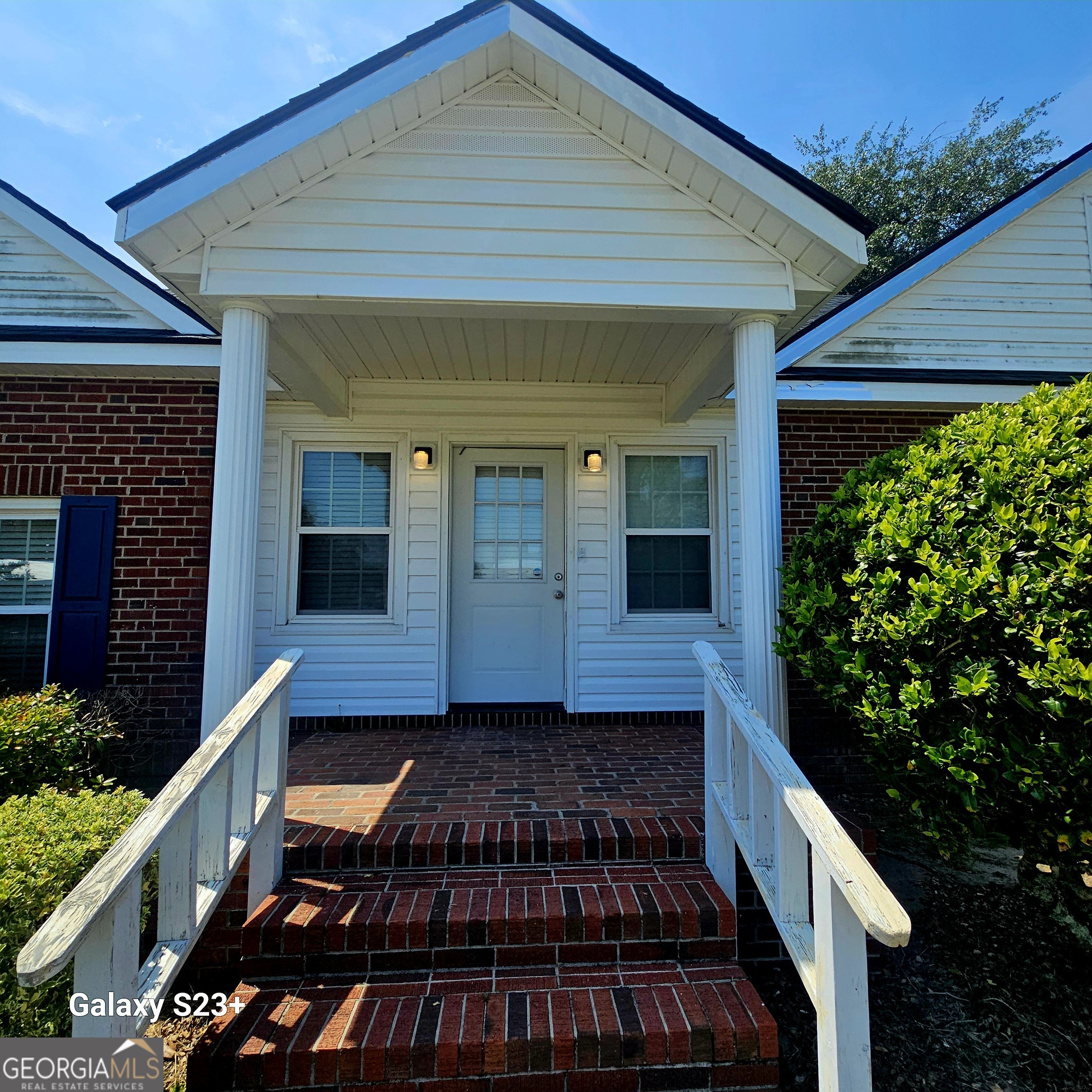 107 East Liberty Street Claxton, GA 30417 - Photo 25 of 29 a front view of a house with a yard