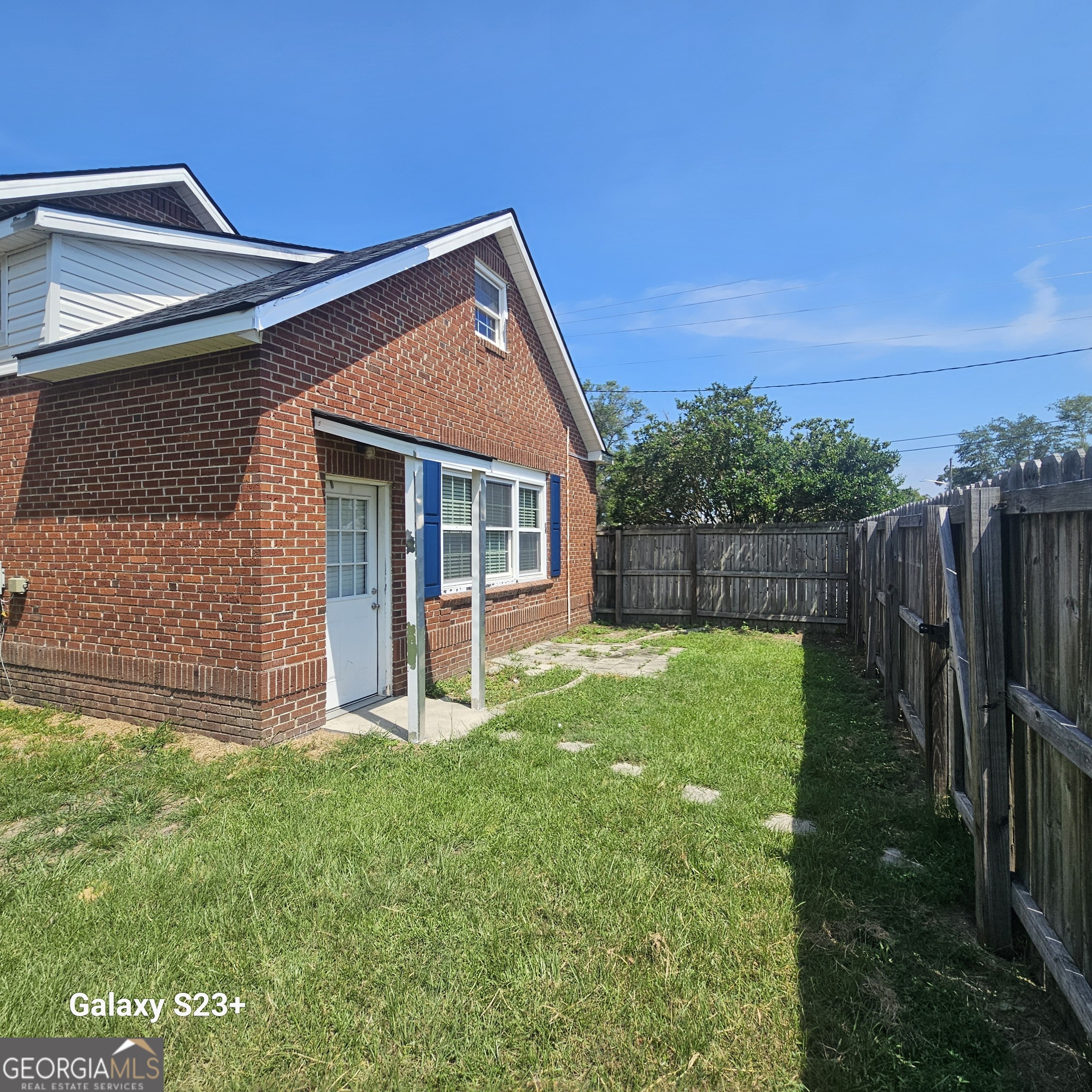 107 East Liberty Street Claxton, GA 30417 - Photo 26 of 29 a view of a house with backyard and porch
