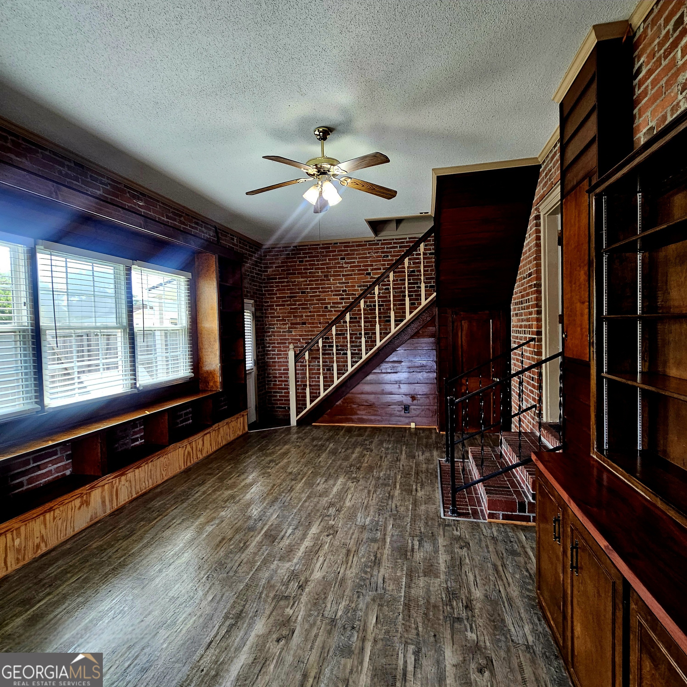 107 East Liberty Street Claxton, GA 30417 - Photo 7 of 29 a view of an entryway with wooden floor
