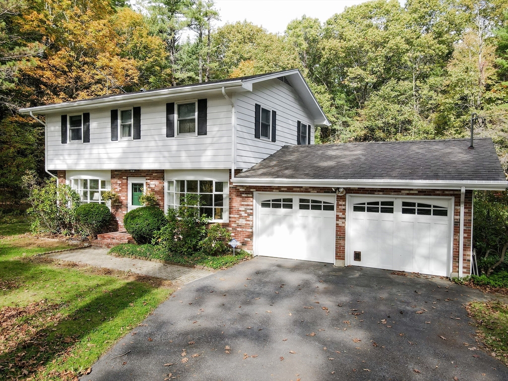 12 Hazen Road Shirley, MA 01464 - Photo 2 of 41 a front view of a house with a garden