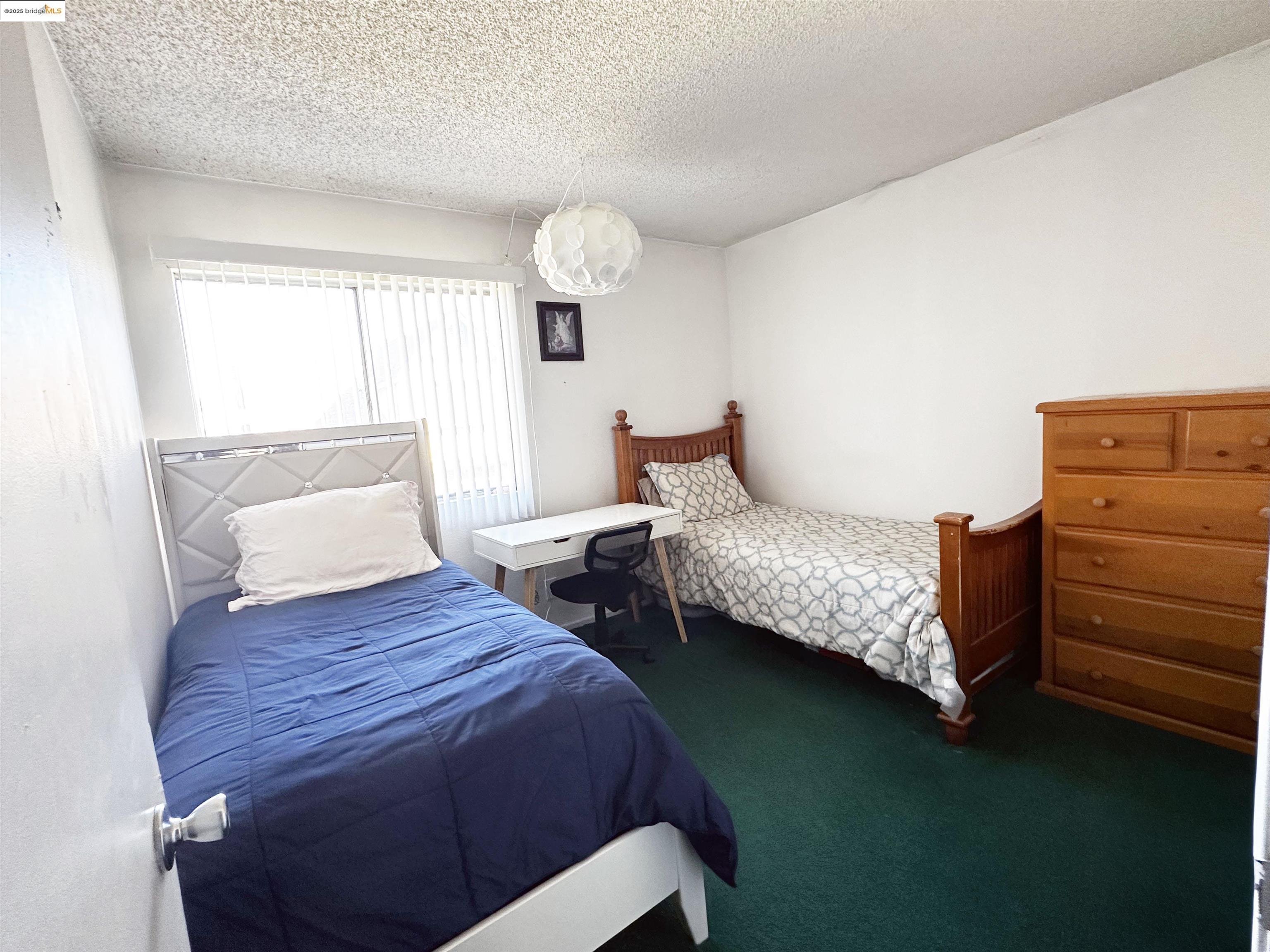 13305 Meyer Road, Unit B Whittier, CA 90605 - Photo 14 of 17 a bedroom with a bed and a window