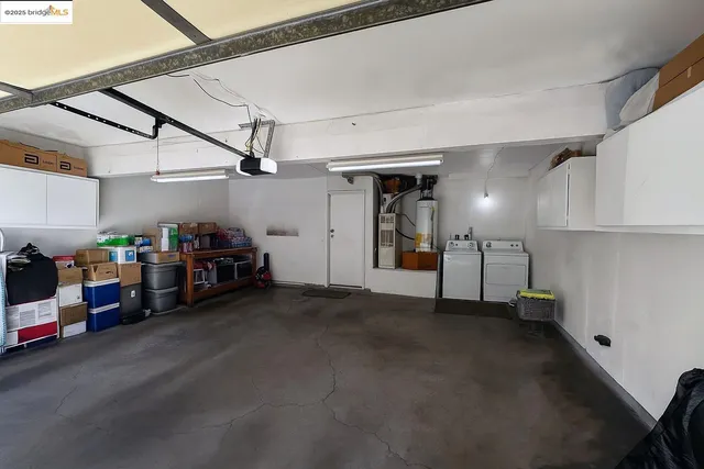 a bathroom with a granite countertop sink mirror vanity and toilet
