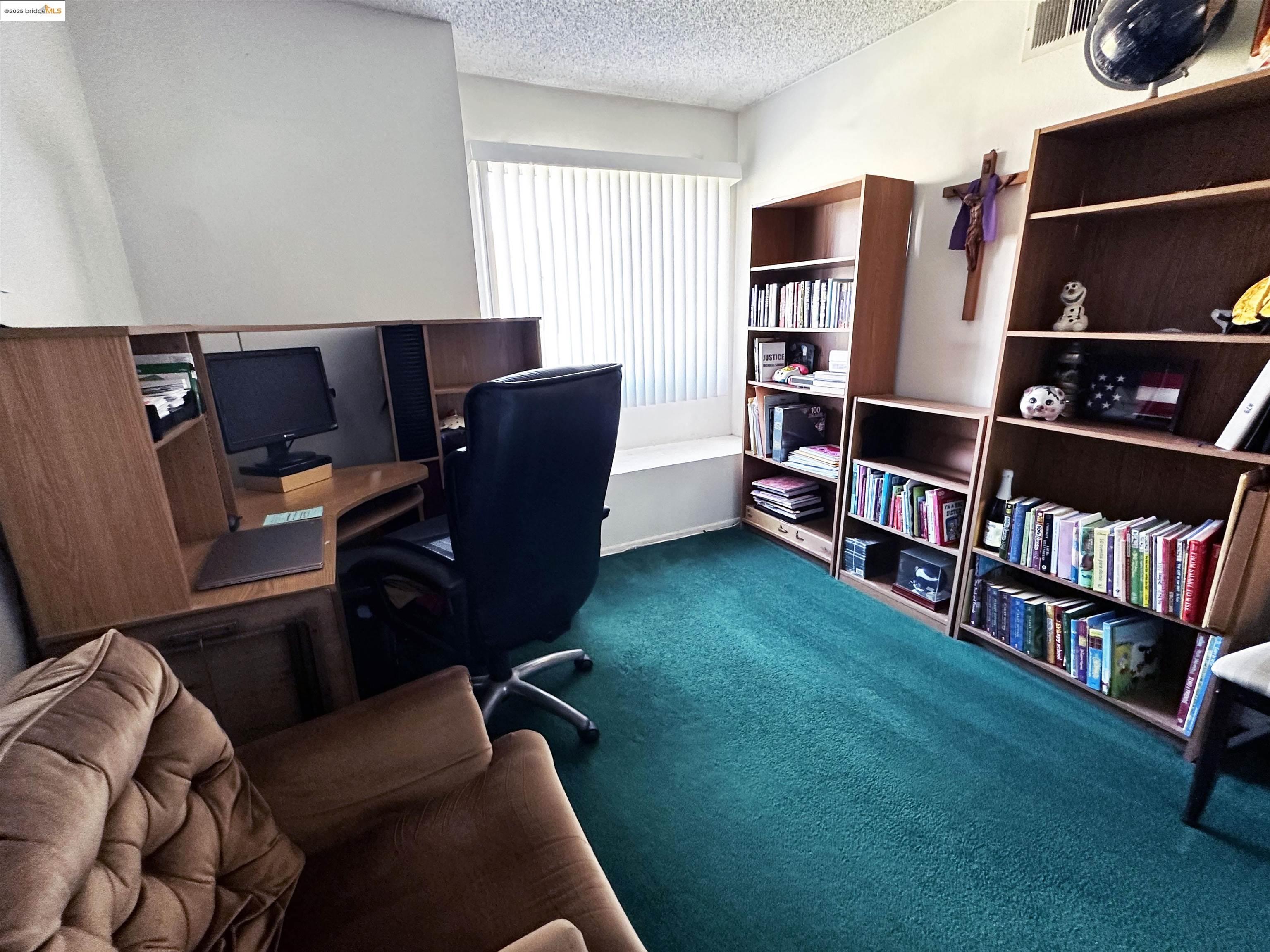 13305 Meyer Road, Unit B Whittier, CA 90605 - Photo 8 of 17 a living room with furniture and a book shelf