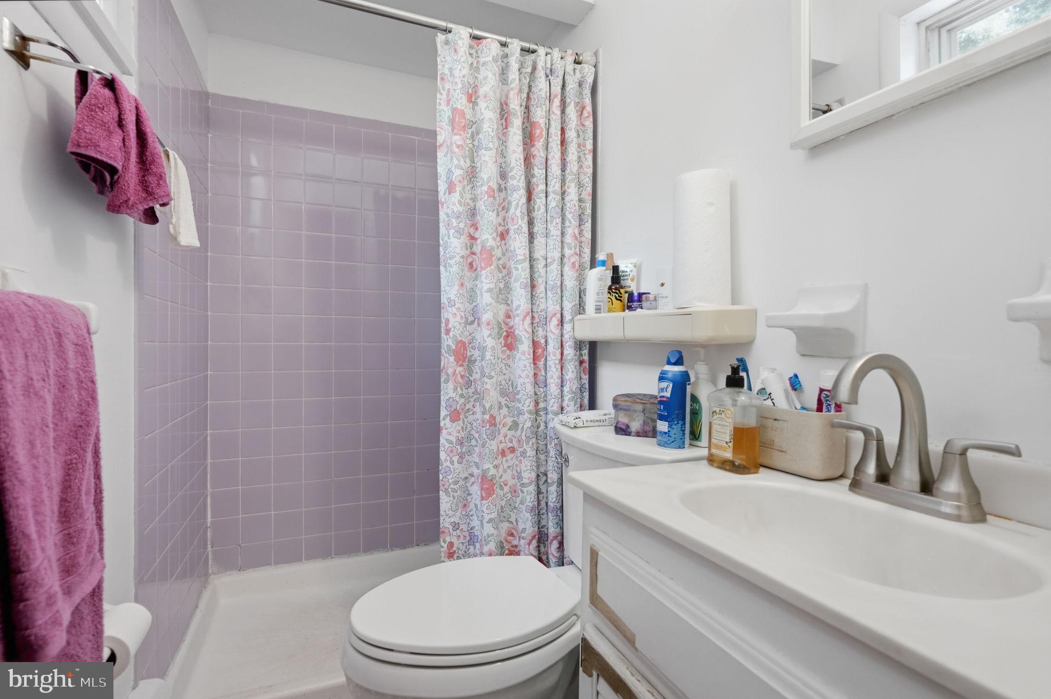318 Warwick Road Lawnside, NJ 08045 - Photo 20 of 25 Charming bathroom with floral accents.