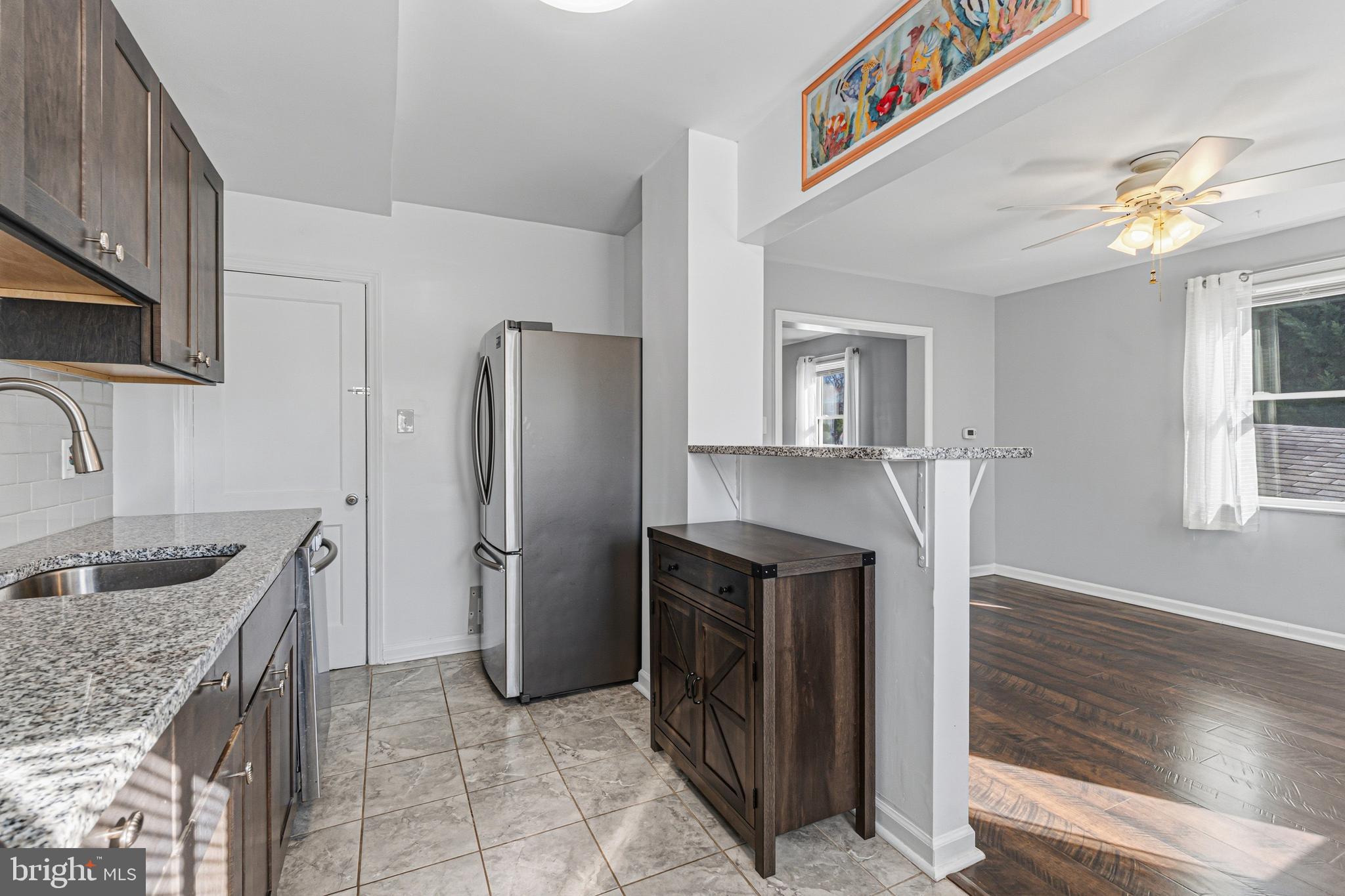5127 Terrace Drive Nottingham, MD 21236 - Photo 11 of 33 a kitchen with refrigerator and cabinets