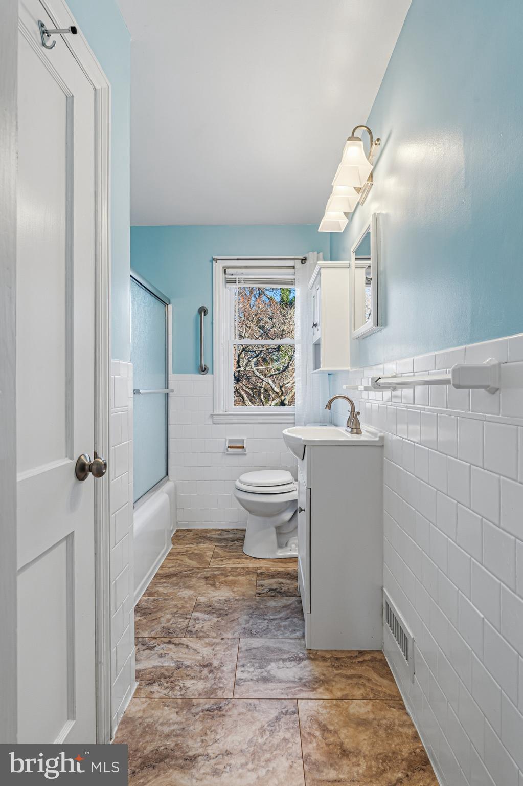 5127 Terrace Drive Nottingham, MD 21236 - Photo 19 of 33 a bathroom with a sink toilet and shower