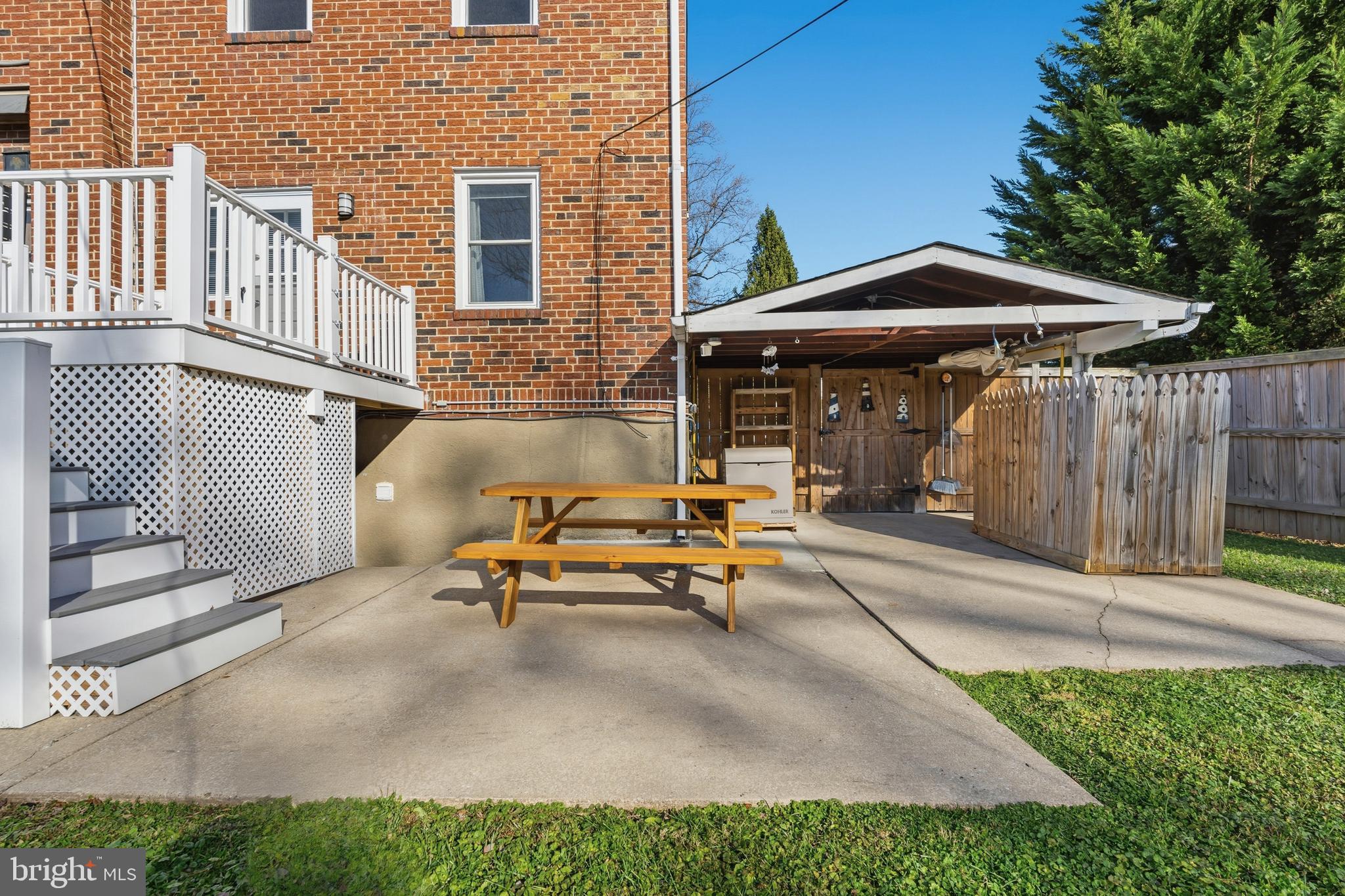 5127 Terrace Drive Nottingham, MD 21236 - Photo 29 of 33 a backyard of a house with barbeque oven table and chairs