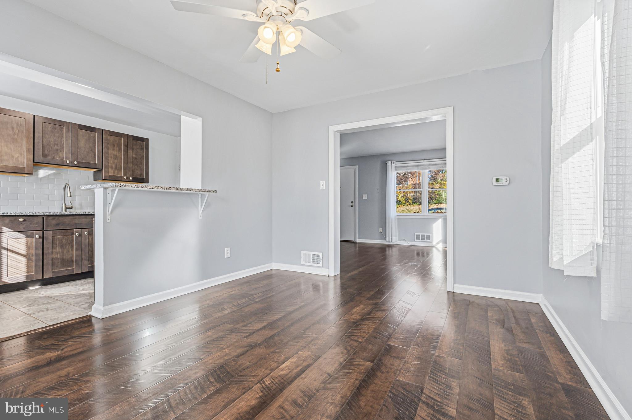 5127 Terrace Drive Nottingham, MD 21236 - Photo 7 of 33 a view of a kitchen with wooden floor and a kitchen