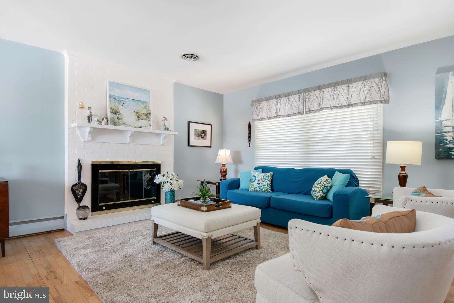 204 Queen Anne Road Stevensville, MD 21666 - Photo 8 of 48 Living room with fireplace
