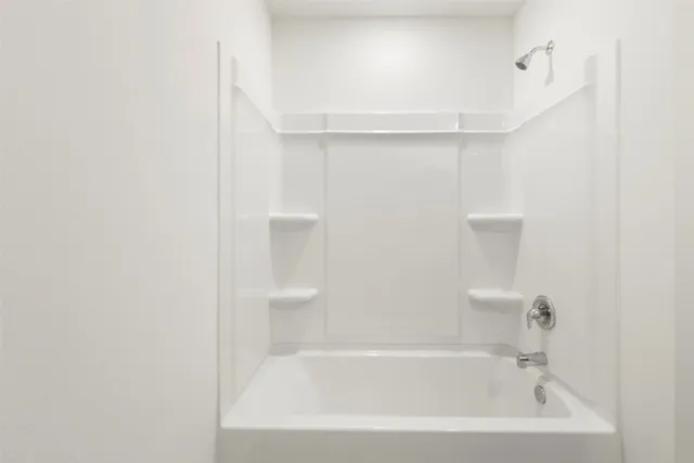 a close view of a bathtub in bathroom