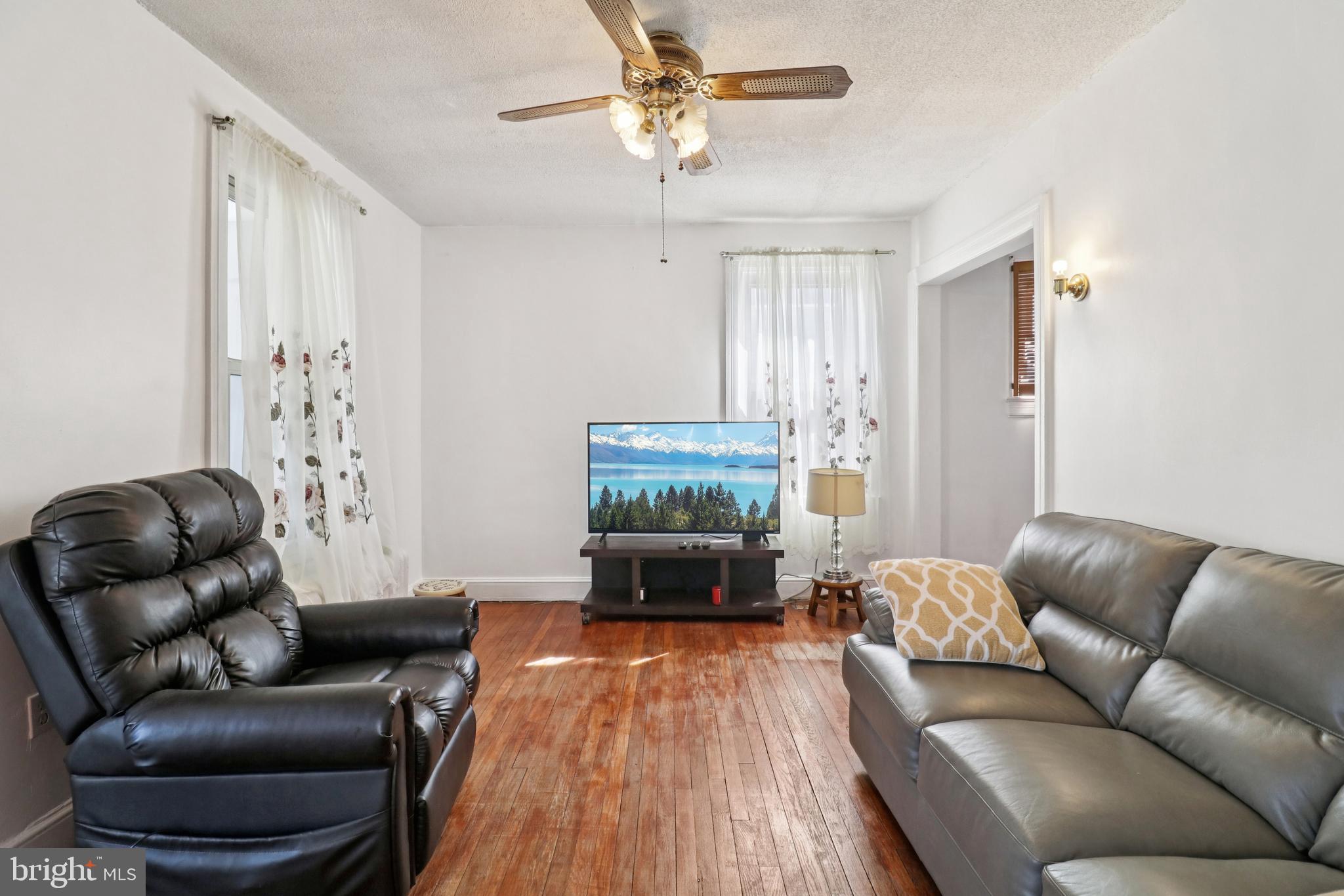 3149 Newton Street Northeast Washington, DC 20018 - Photo 13 of 57 Living room has hardwood floors