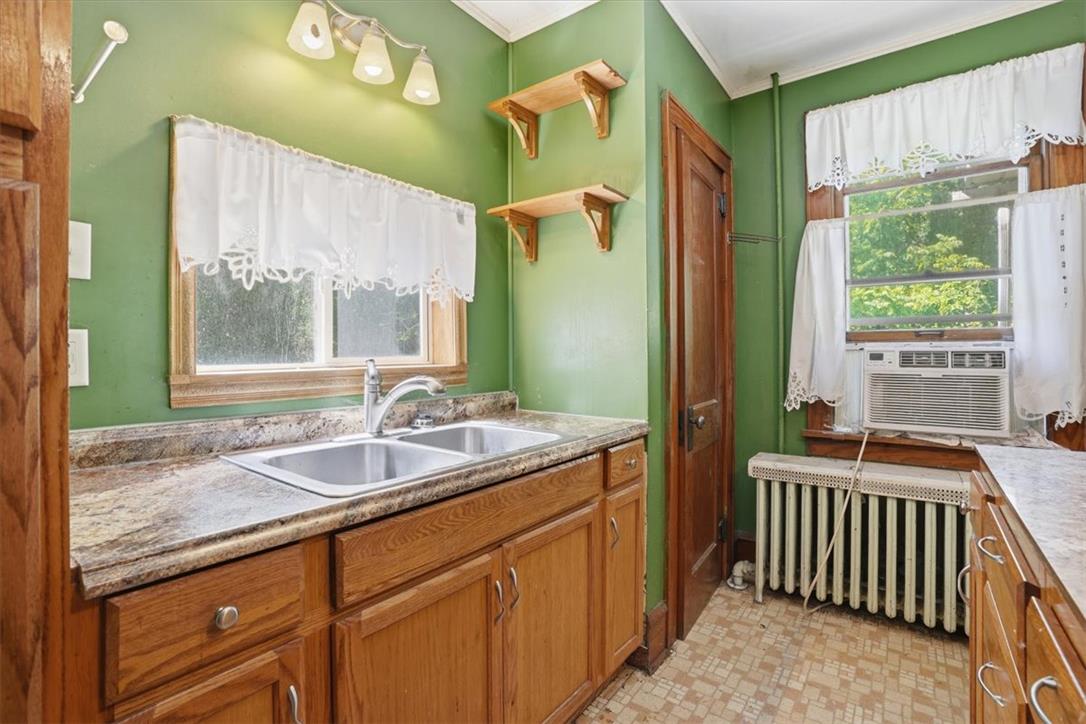 167 Main Road Lehighton, PA 18235 - Photo 13 of 41 A utilitarian kitchen with ample storage cabinetry and a dual-basin sink provides functional convenience.