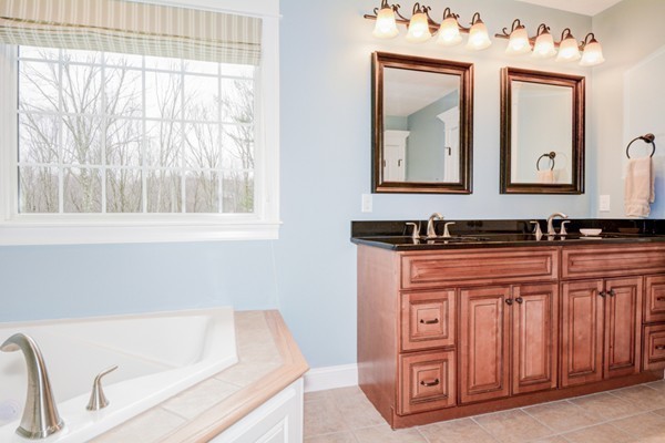 45 Putnam Hill Road Sutton, MA 01590 - Photo 17 of 30 a bathroom with a sink and a mirror