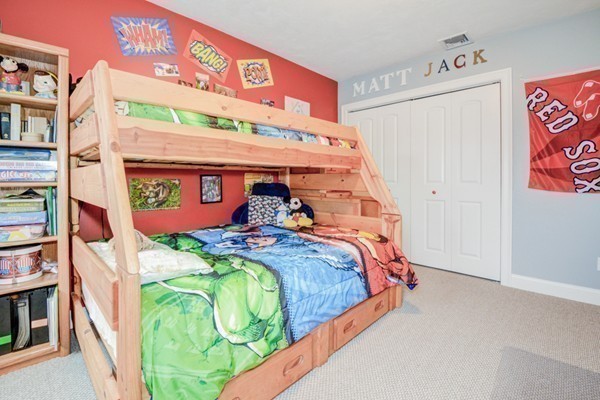 45 Putnam Hill Road Sutton, MA 01590 - Photo 20 of 30 a bed with a bed and a painting on the wall