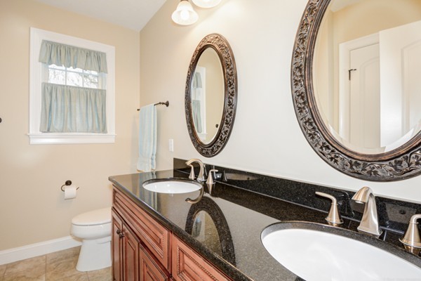 45 Putnam Hill Road Sutton, MA 01590 - Photo 21 of 30 a bathroom with a sink and a mirror