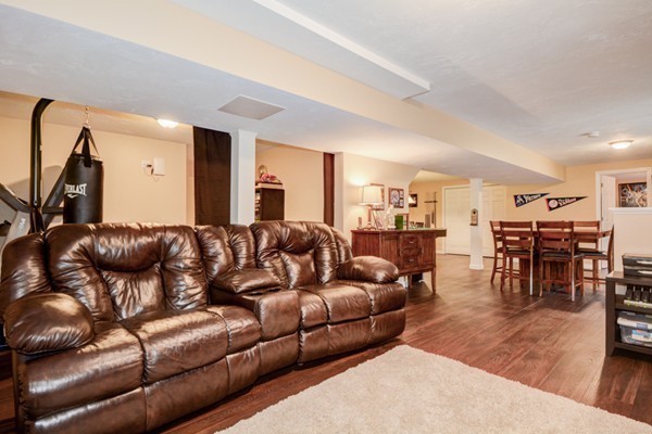45 Putnam Hill Road Sutton, MA 01590 - Photo 24 of 30 a living room with furniture kitchen view and a wooden floor
