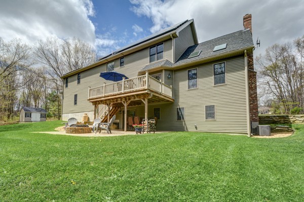 45 Putnam Hill Road Sutton, MA 01590 - Photo 3 of 30 a view of a house with a yard and a patio