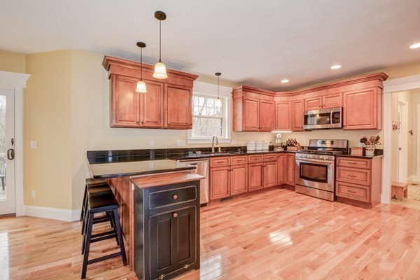 45 Putnam Hill Road Sutton, MA 01590 - Photo 4 of 30 a kitchen with stainless steel appliances granite countertop a stove sink and cabinets