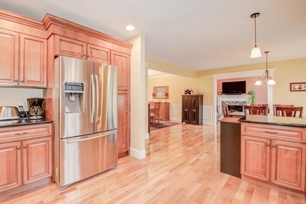 45 Putnam Hill Road Sutton, MA 01590 - Photo 5 of 30 a kitchen with stainless steel appliances granite countertop a refrigerator a stove top oven a sink and dishwasher with wooden floor
