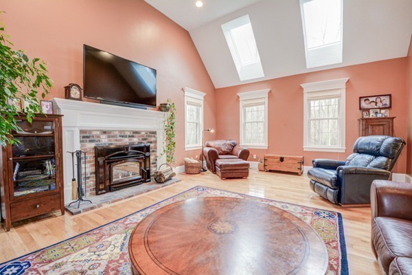 45 Putnam Hill Road Sutton, MA 01590 - Photo 10 of 30 a living room with furniture and a fireplace