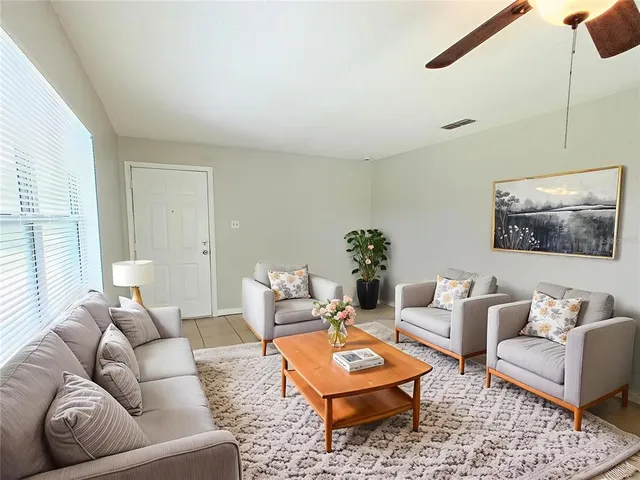 a living room with furniture and a rug